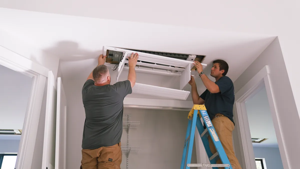 MC Electric team installing mini split