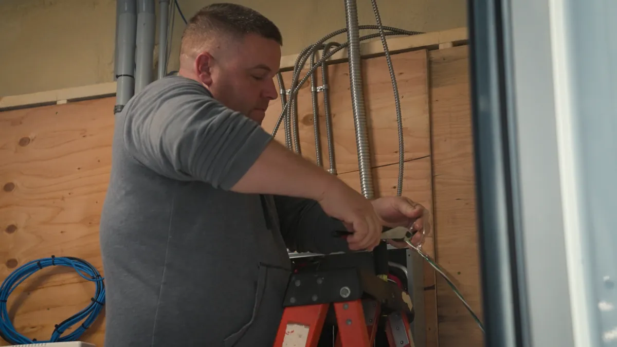 MC Electric technician performing electrical wiring