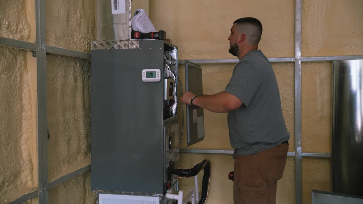 Technician servicing generator controls