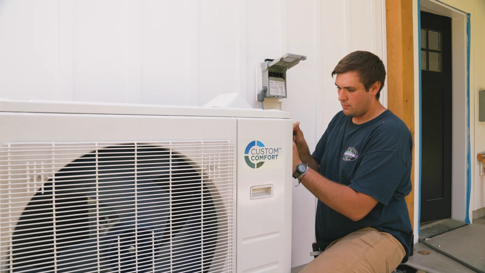 HVAC technician diagnosing ductless mini split system error code
