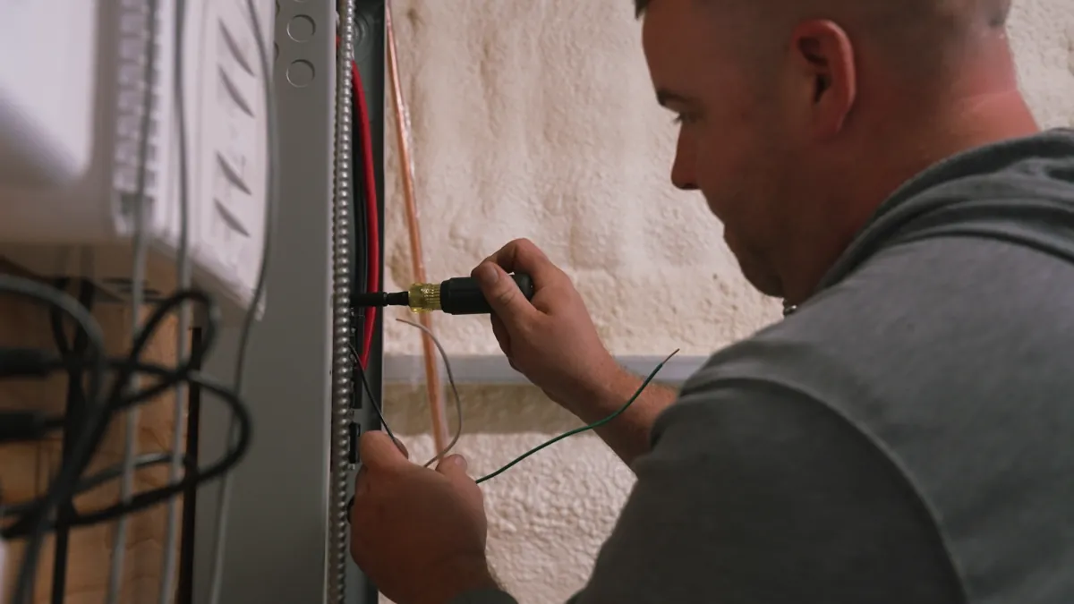 MC Electric technician performing heating system repair